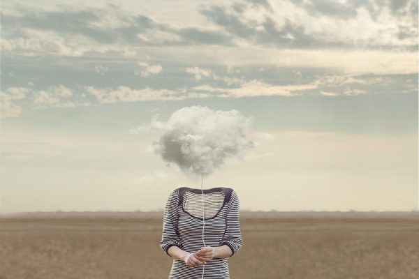Woman's,Head,Replaced,By,A,Soft,Cloud